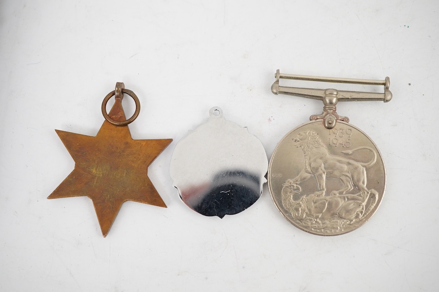 A WWII Defence medal and The France and Germany Star together with a cased Royal Navy Reserve Decoration, plus a Royal Air Force Association medallion, (4). Condition - fair to good.